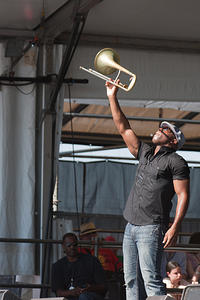 Big Sam holds up trombone