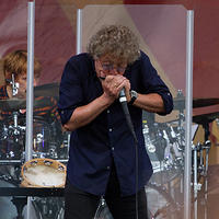 Roger plays harmonica